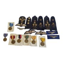 A COLLECTION OF VINTAGE BRITISH MILITARY INSIGNIA BADGES, AND RIBBONS To include an RFC badge, two