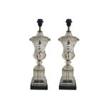 A PAIR OF CONTINENTAL GILT METAL BANDED GLASS TABLE LAMPS Classical urn form, standing on ribbed