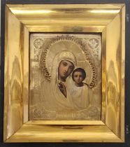 A 19TH CENTURY RUSSIAN WHITE METAL CLAD OIL ON PANEL RELIGIOUS ICON Madonna and Child with