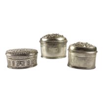 THREE LATE 19TH/EARLY 20TH CENTURY OVAL BURMESE SILVER BETEL LIME BOXES Having two having chased