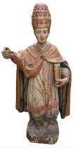 A LARGE 16TH/17TH CENTURY CARVED WOOD POLYCHROME AND GILDED STATUE OF A POPE Wearing the triple