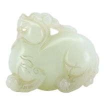 A CHINESE WHITE JADE CARVING OF A QILIN The mythical beast is nicely carved and pierced underneath