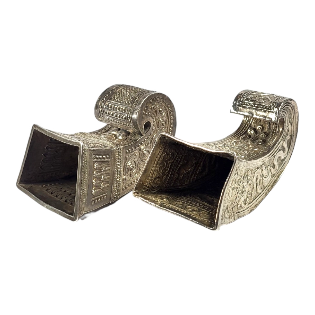 TWO LATE 19TH/EARLY 20TH CENTURY BURMESE SILVER BETEL LEAF HOLDERS Both having intricate chased