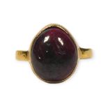 A GEORGIAN YELLOW METAL AND CABOCHON GARNET RING, YELLOW METAL TESTED AS 18CT AND 9CT GOLD