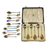 RATTRAY & CO. A CASED SET OF CONTINENTAL SILVER AND ENAMEL TEASPOONS, IMPORT HALLMARK FOR LONDON,