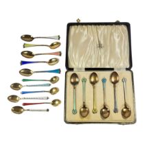 RATTRAY & CO. A CASED SET OF CONTINENTAL SILVER AND ENAMEL TEASPOONS, IMPORT HALLMARK FOR LONDON,