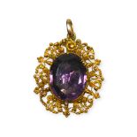 AN EARLY 19TH CENTURY GEORGIAN CANNETILLE YELLOW METAL AND AMETHYST FILIGREE PENDANT, YELLOW METAL