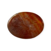 AN 18TH/19TH CENTURY CARVED CARNELIAN INTAGLIO DEPICTING NIKE DRIVING A CHARIOT/BIGA Winged Nike/