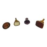 A COLLECTION OF THREE 19TH CENTURY YELLOW METAL FOB SEALS AND OTHER Two tested for 9ct gold, the