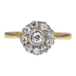 AN EDWARDIAN 18CT YELLOW METAL AND DIAMOND CLUSTER RING Central bezel set round old European cut