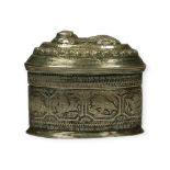 A LATE 19TH/EARLY 20TH CENTURY BURMESE SILVER BETEL OVAL LIME BOX Having chased chin the (lion)