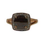 AN 18CT GOLD AND 1.2CT BROWN DIAMOND RING The central rose cut brown diamond (approx. 8mm)