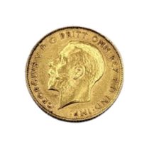 A 22CT GOLD HALF SOVEREIGN With a George V portrait bust, dated 1911, St. George and dragon verso.