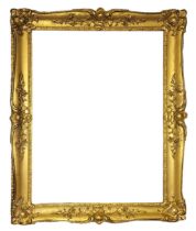 A 19TH CENTURY CARVED GILDED RECTANGULAR PICTURE FRAME With scrolled decoration. (aperture approx