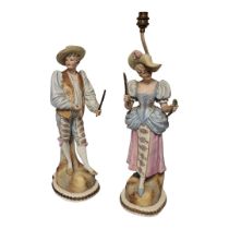 A LARGE PAIR OF 19TH CENTURY FRENCH BISQUE PORCELAIN FIGURAL LAMPS Male and female wearing colourful