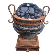 A 19TH CENTURY IRON FRONT BASKET/FIRE GRATE In the shape of an Ancient twin handled urn, with some