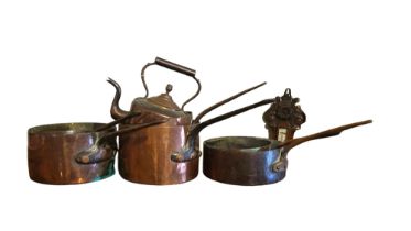 AN EARLY VICTORIAN SELECTION OF SIX VARIOUS HEAVY BRASS KITCHEN COOKING PANS With cast iron handles,