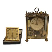 KOMA, A MID 20TH CENTURY BRASS 400 DAY CLOCK Having a single handle and four glass panels,
