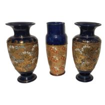 A PAIR OF ROYAL DOULTON AND SLATERS STONEWARE POTTERY VASES Impressed lace design on blue ground,