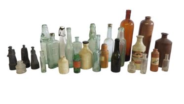 A SMALL COLLECTION OF LATE VICTORIAN AND LATER STONEWARE BOTTLES Medicine glass bottles,