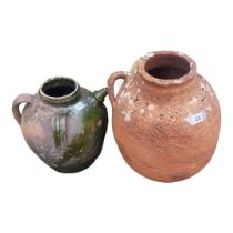 A 20TH CENTURY GARDEN TERRACOTTA TWIN HANDLED VASE Along with Spanish style terracotta olive oil