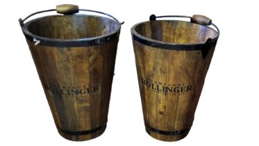 A PAIR OF TEAK IRON BOUND BUCKETS Branded ‘Bollinger Champagne’. (diameter 30cm x 40cm) Condition: