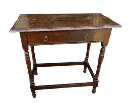 A JAMES II PERIOD OAK SIDE TABLE With single drawer, on square and turned legs, Circa 1685. (88cm