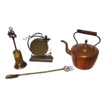 A VICTORIAN COPPER KETTLE Having a single handle and castellated seam, together with a brass gong,