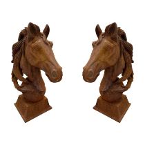 A PAIR OF CAST IRON SCULPTURES Horses head on plinth bases. (18cm x 31cm x 45cm) Condition: good