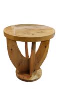 A CONTINENTAL ART DECO DESIGN LACQUERED MAPLE OCCASIONAL TABLE The circular top raised on stylised