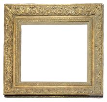 A 19TH CENTURY GILDED RECTANGULAR PICTURE FRAME With carved scrolled decoration. (aperture approx