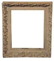 A LARGE 20TH CENTURY CARVED GILTWOOD RECTANGULAR PICTURE FRAME With carved scrolled decoration. (