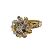 A FRENCH 18CT BICOLOUR GOLD AND DIAMOND CLUSTER RING The arrangement of round cut diamonds with