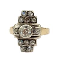 AN ART DECO 18CT GOLD, DIAMOND CLUSTER RING The central round cut diamond flanked by two rows of