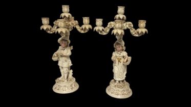 SITZENDORF, A PAIR OF 19TH CENTURY GERMAN PORCELAIN FIGURAL CANDELABRA Young male and female wearing