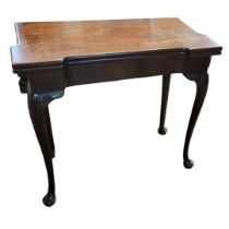 AN 18TH CENTURY MAHOGANY BREAKFRONT FOLD OVER CARD TABLE The green baize playing surface raised on