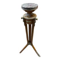 A REGENCY STYLE MAHOGANY TORCHÈRE With brass banded circular rouge marble top on platform, raised on