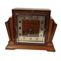 AN ART DECO INLAID MAHOGANY MANTEL CLOCK Having a stepped case,square chrome bezel and chiming