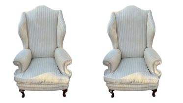 A PAIR OF EARLY 20TH CENTURY GEORGIAN STYLE WING ARMCHAIRS In oatmeal fabric upholstery with loose