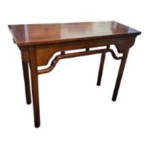 A CHINESE HARDWOOD ALTAR TABLE The rectangular top above a pierced apron, raised on turned legs. (