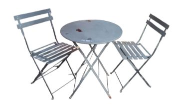 A GREY PAINTED MILD STEEL FOLDING CAFE TABLE AND TWO CHAIRS. (60cm x 60cm x 71cm) Condition: some