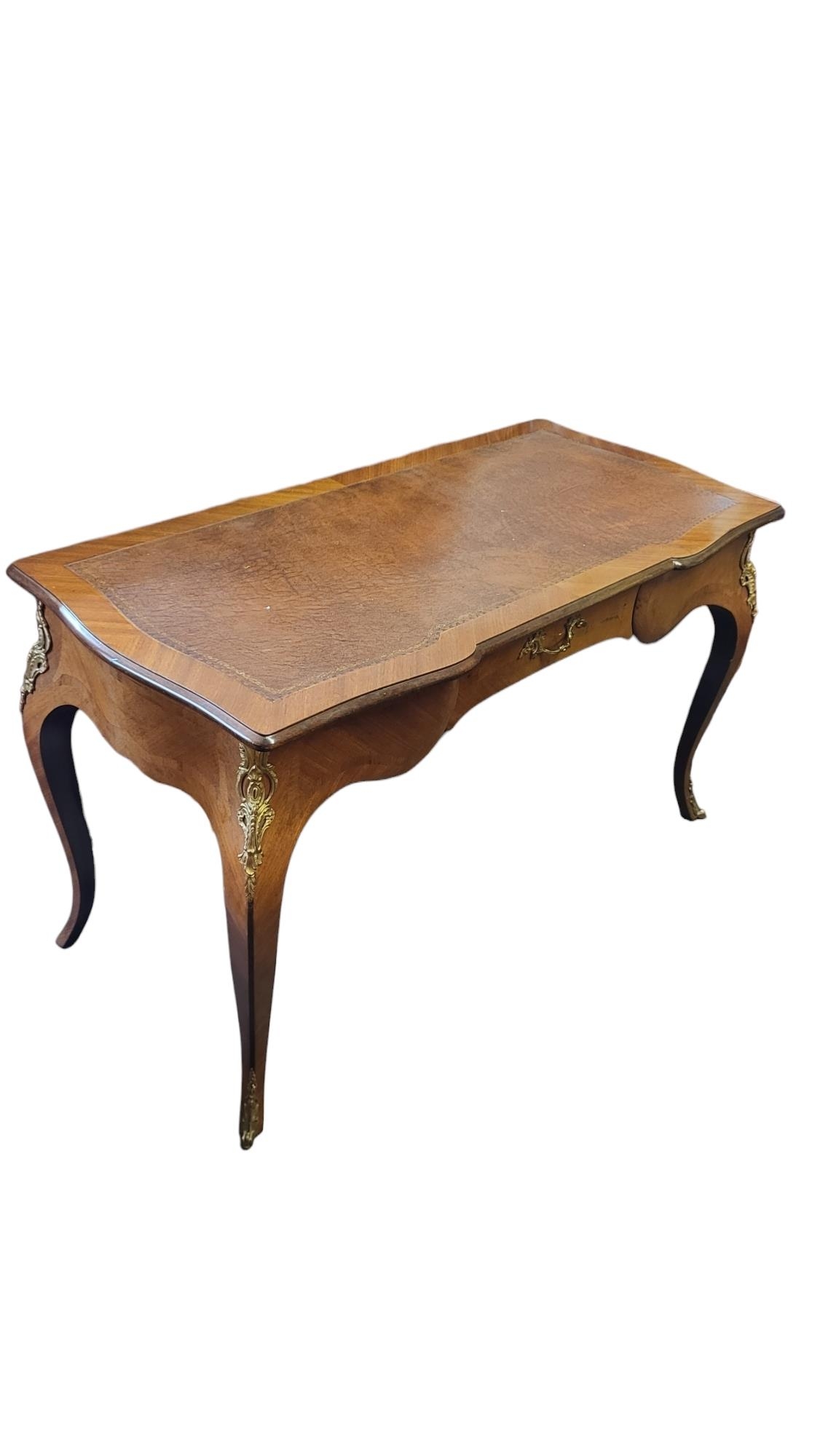A LOUIS XVI REVIVAL WRITING TABLE With brown tooled leather surface above a single drawer, on gilt