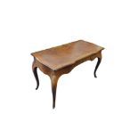 A LOUIS XVI REVIVAL WRITING TABLE With brown tooled leather surface above a single drawer, on gilt