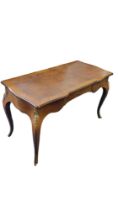 A LOUIS XVI REVIVAL WRITING TABLE With brown tooled leather surface above a single drawer, on gilt