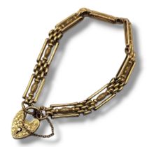 A LATE 19TH/EARLY 20TH CENTURY 9CT GOLD GATE BRACELET Having rectangular form links with central