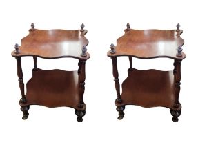 A PAIR OF VICTORIAN MAHOGANY TWO TIER WHATNOT SIDE TABLES The serpentine tops raised on turned