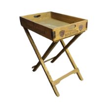 A VINEYARD PINE BUTLER’S TRAY TABLE ON FOLDING STAND Bearing Champagne branding. (65cm x 45cm x
