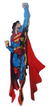 A VERY LARGE HAND PAINTED WOODEN THEATRE PROP, SUPERMAN. (w 108cm x h 306cm) Condition: good overall