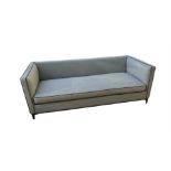 A CAMERICH THREE SEATER SETTEE In pale blue fabric with dark grey piping and loose cushions on metal