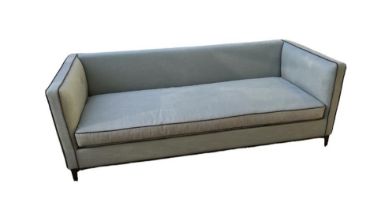 A CAMERICH THREE SEATER SETTEE In pale blue fabric with dark grey piping and loose cushions on metal